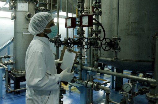 Technicians of the International Atomic Energy Agency inspect the site ot the uranium coversion plat of Isfahan
